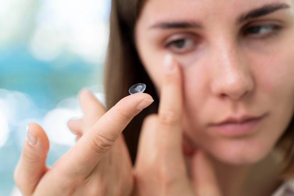 woman-checking-some-new-lenses opti